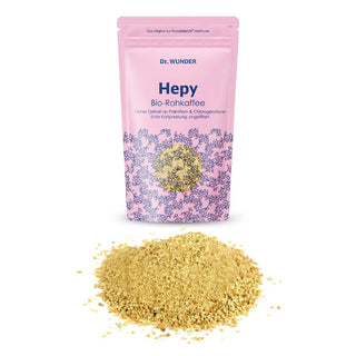 HEPY Kaffee BIO rosafarbener Standbeutel mit goldenem Rohkaffeepulver davor auf weißem Hintergrund