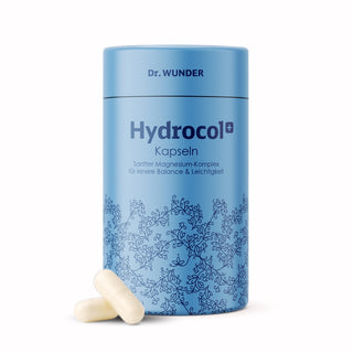 Dr. Wunder Hydrocol+ Kapseln in hellblauer Dose mit floralem Muster und zwei weissen Kapseln davor