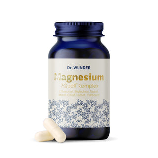 Magnesium 7Quell-Komplex von Dr. Wunder – dunkelblaue Glasflasche mit 7 Magnesiumsalzen und zwei weißen Kapseln