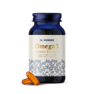Dr. Wunder Omega 3 Superior-Komplex blaue Glasflasche mit zwei goldenen Kapseln davor